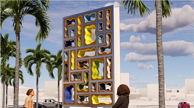 Fourteen-foot-high abstract sculpture with some colorful holes in it