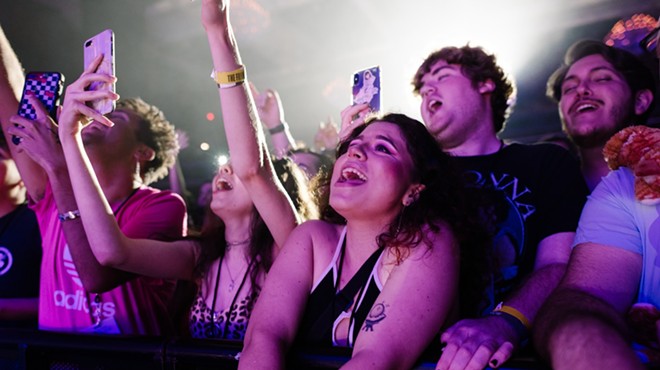 Fans cheering from the front row at the Fillmore Miami Beach