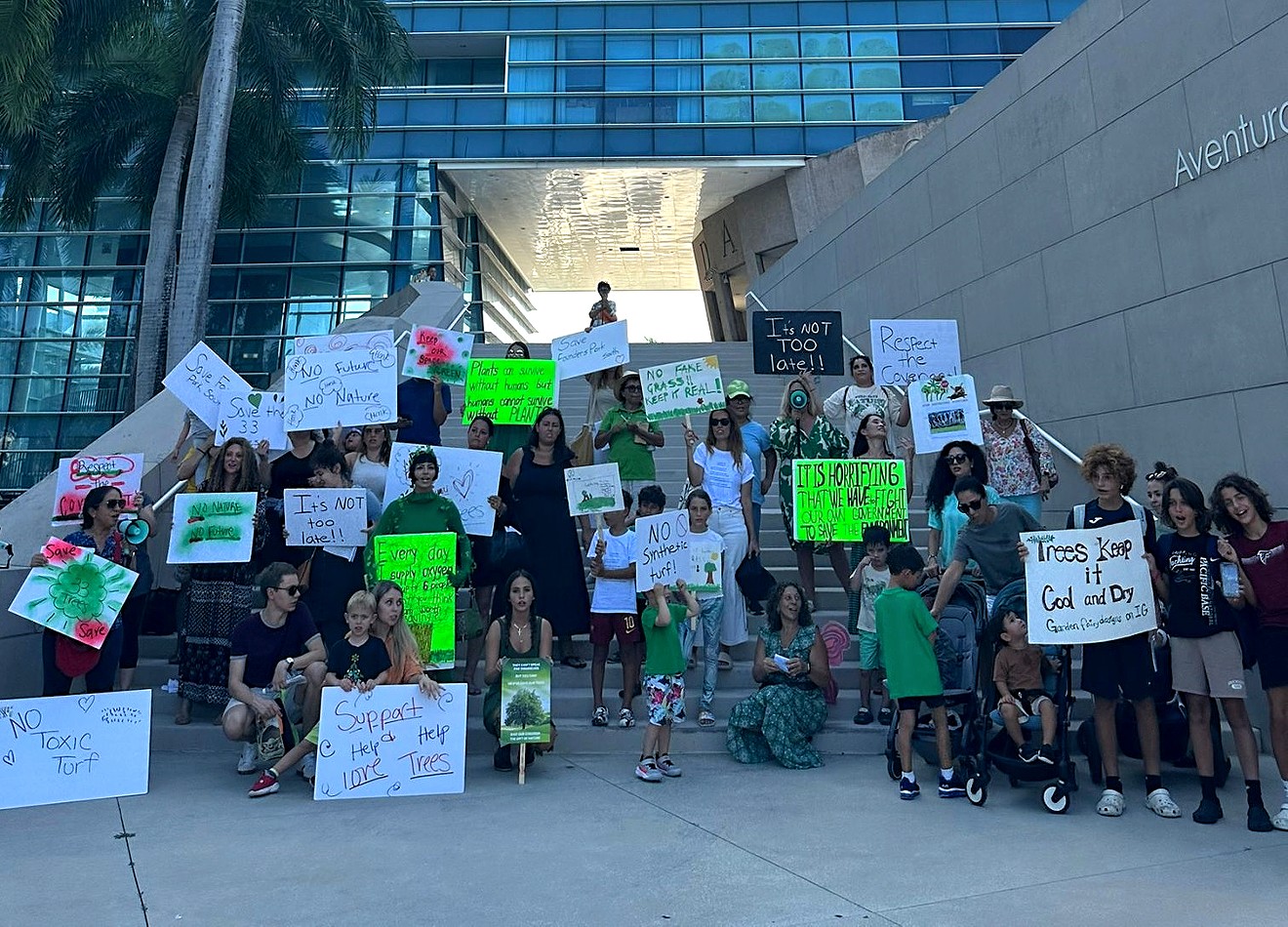 Protesters gather near Aventura city hall to speak out against the construction of pickleball courts at Founders Park South.