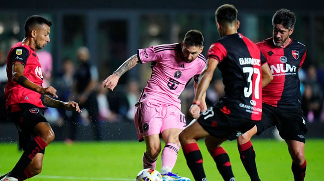 Soccer legend Lionel Messi shoots the ball during a home game against Newell's Old Boys