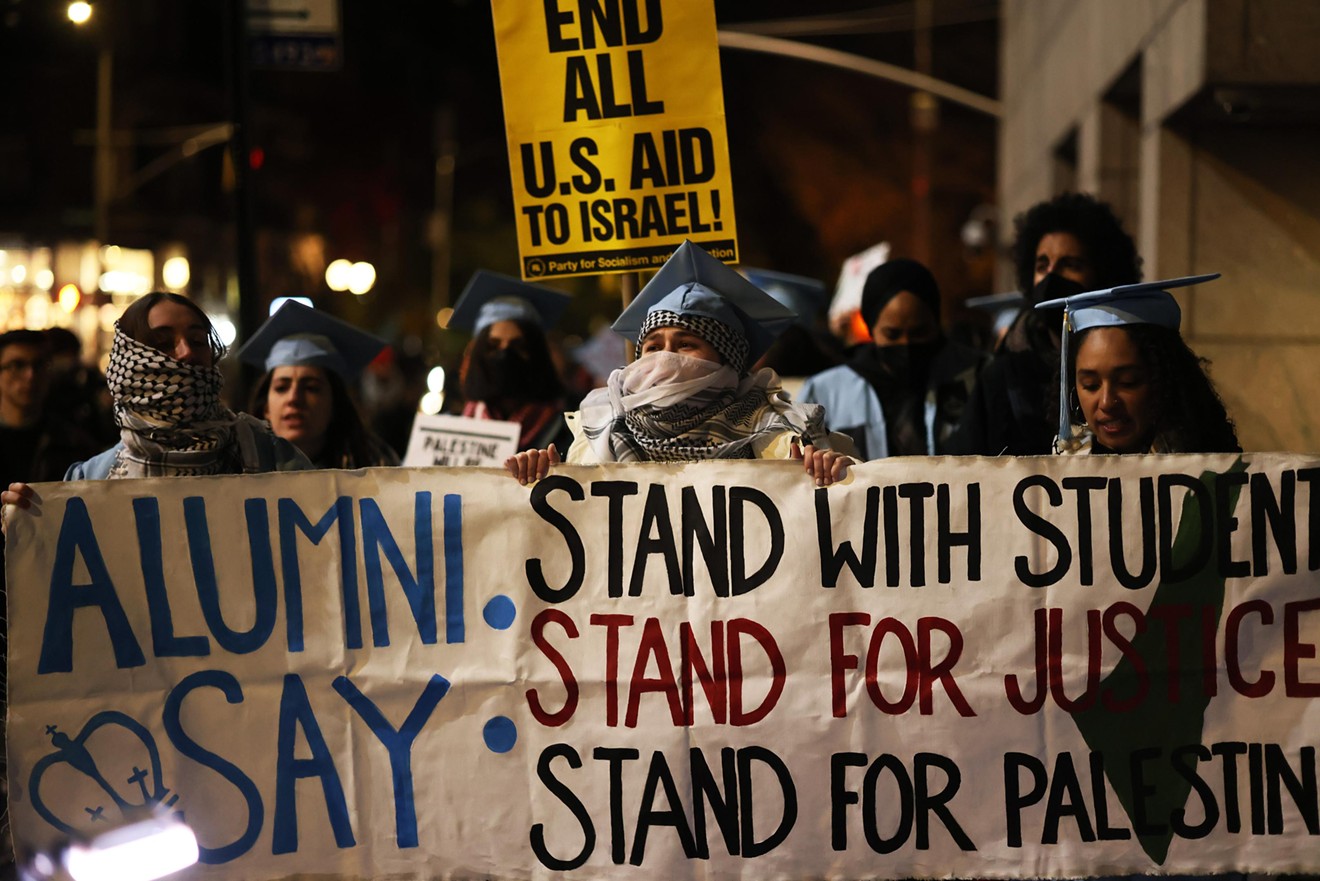 People march as they gather to protest the banning of Students for Justice in Palestine (SJP) and Jewish Voice for Peace (JVP) at Columbia University on November 20, 2023.